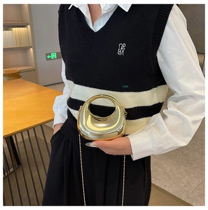 Chic gold metallic moon clutch bag with circular handle and detachable bead chain strap