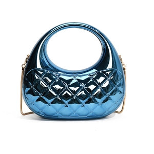 Metallic blue quilted acrylic box bag with circular top handle and gold chain strap