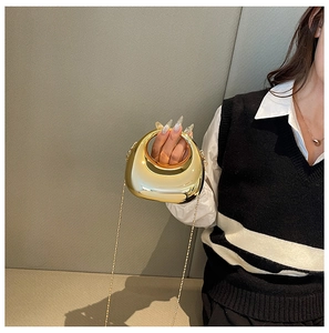 Champagne gold mini acrylic evening bag with spherical chain strap and round top handle