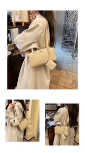 Detail view of cream white minimalist underarm bag with small matching coin purse pouch