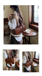 Detail of minimalist brown leather shoulder bag with matching mini coin purse accessory