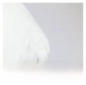 Detailed macro view of high-quality white quilted nylon fabric for crossbody bags