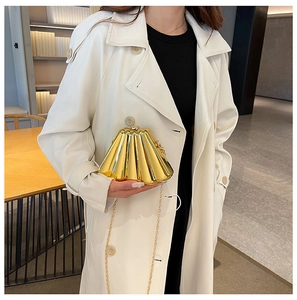 Chic gold fan-shaped metal evening clutch bag with chain strap for modern women