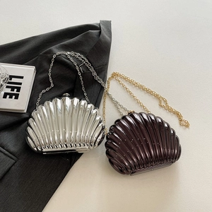 Metallic shell-shaped evening bags in silver and coffee with elegant metal chain straps