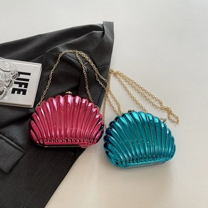 Fashionable metallic shell clutch bags in hot pink and lake blue with gold chain straps