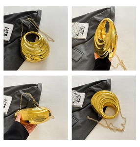 Detail view of gold metallic evening bag showing 3D wave texture and slim chain strap