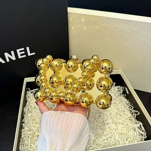 Chic metallic gold shell clutch bag with bubble texture and elegant chain strap for parties