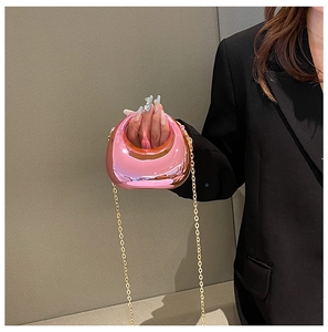 Mini acrylic crescent handbag in metallic hot pink with a fine gold chain strap detail