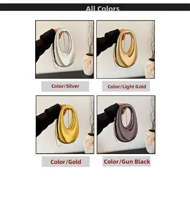 Detailansicht der ovalen Acryl-Abendtaschen in Silber, Gold und Schwarz mit Kettenriemen