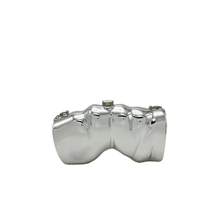 Macro view of silver metallic clutch with irregular wave texture and top cylinder clasp