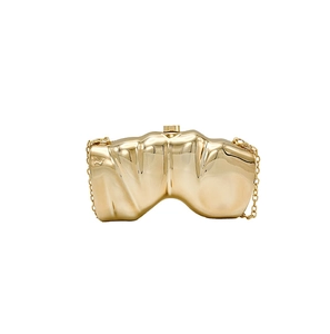 Detailed view of the wavy metallic gold evening clutch bag with glossy mirror finish
