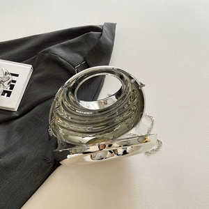 Chic silver metallic evening clutch bag with circular handle and elegant chain strap