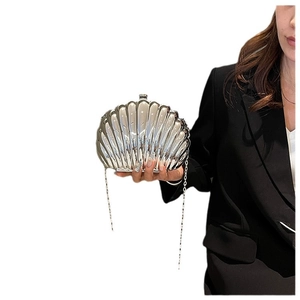 Elegant shiny silver shell-shaped clutch bag with metal chain strap for women