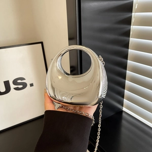 Mini silver crescent acrylic bag with mirror finish and circular cutout handle