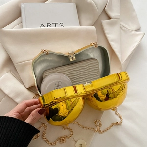 Unique gold heart-shaped hard shell evening clutch with chain strap and spacious interior