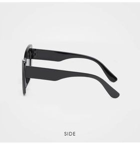 Side view of black cat-eye sunglasses with wide temples and high gloss finish