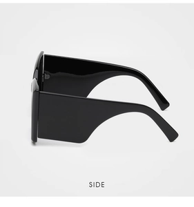 Side view of oversized thick frame black sunglasses with wide glossy temples for UV protection