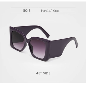 Detail view of bold purple square sunglasses with gradient lenses and thick geometric arms