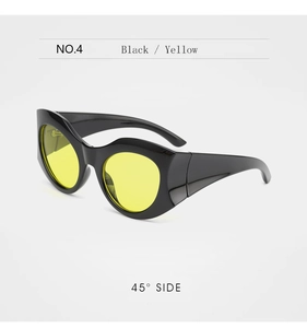 Detail view of bold black frames and translucent yellow lenses on stylish cat-eye sunglasses