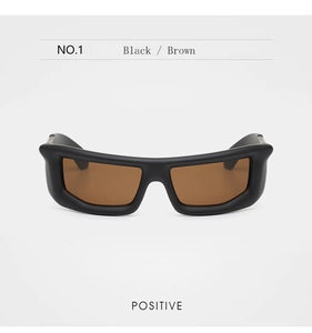 Front view of matte black oversized sunglasses with brown gradient lenses and bold frames