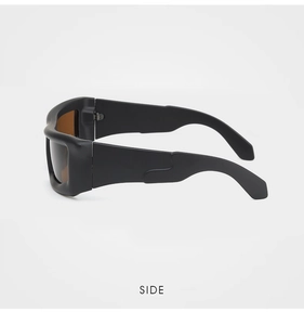 Side view of matte black wrap-around sunglasses with thick wave-shaped temples