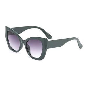 Chic cat-eye sunglasses with dark green frames and purple gradient lenses on white backdrop