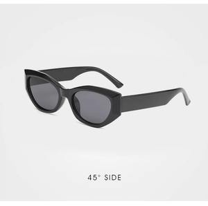 Detail view of black cat-eye sunglasses with gray lenses at a 45-degree angle side profile