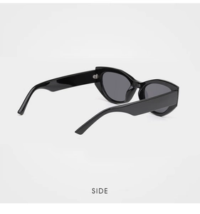 Detailed side view of black oversized cat-eye sunglasses with thick glossy temples