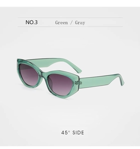 Close-up of green translucent cat-eye sunglasses with purple gradient lenses at 45-degree angle