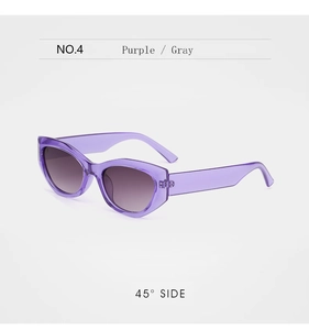 Detail view of purple cat-eye sunglasses with gray gradient lenses from a 45-degree angle