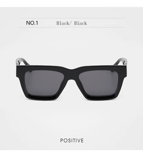 Front view of stylish black square frame sunglasses with thick edges and modern wide temples