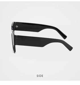 Side view detail of black square frame sunglasses with wide flat temples and glossy finish