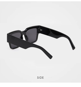 Side view detail showing thick black square frames and sturdy metal hinges on sunglasses