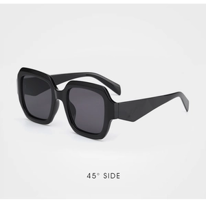 Detail of square black sunglasses with glossy frames at a 45-degree side view