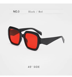 Detailed 45-degree side view of black square frame sunglasses with red lenses