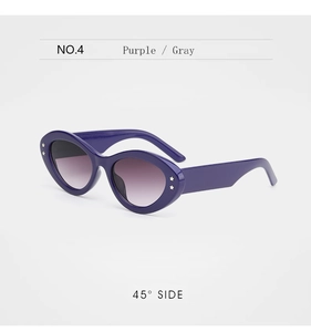 Detail view of purple cat-eye sunglasses featuring silver star studs and gradient lenses
