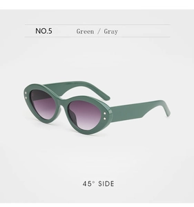 45-degree side view of dark green oval sunglasses with silver star studs and gradient lenses