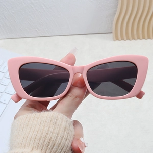 Retro cat-eye sunglasses with pink frames and dark gray UV protection lenses for women