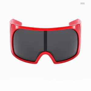 Close-up of futuristic shield sunglasses featuring bold red frames and grey lenses