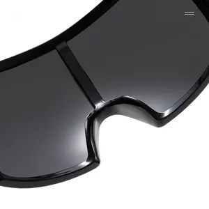 Close-up of the smooth black bridge and polished frame of the oversized fashion sunglasses