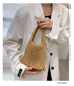 Detailed macro view of handmade cotton rope weave on a beige hollow tote bag