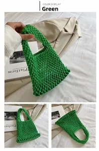 Close-up of green hand-woven cotton rope mesh bag with hollow structure and solid base