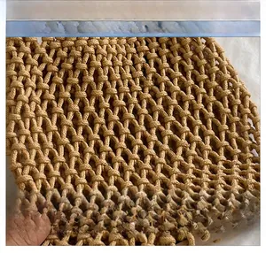 Close-up of khaki handmade cotton rope woven bag showing hollow grid texture and material