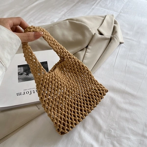 Handmade woven cotton rope hollow beach bag for women in tan with shoulder straps