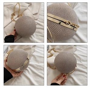 Detail view of champagne gold spherical evening bag with metal ring handle and chain