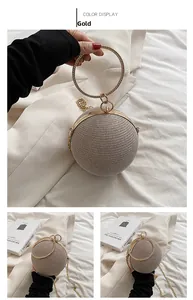 Detail of spherical gold evening bag with metal ring handle and fine chain strap