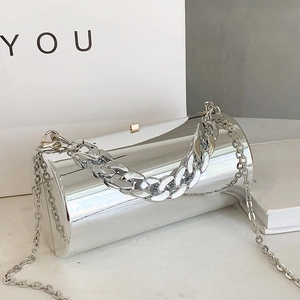 Silver mirror cylinder bag with chunky chain handle and sleek metal crossbody strap