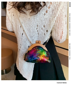 Detailed shot of rainbow sequin shell bag with wooden frame and pearl chain strap