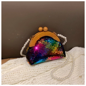 Detail of colorful sequin evening bag with wooden frame and pearl chain strap