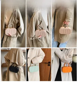 Various ways to wear the acrylic hard shell mini bag with twist handle and chain strap
